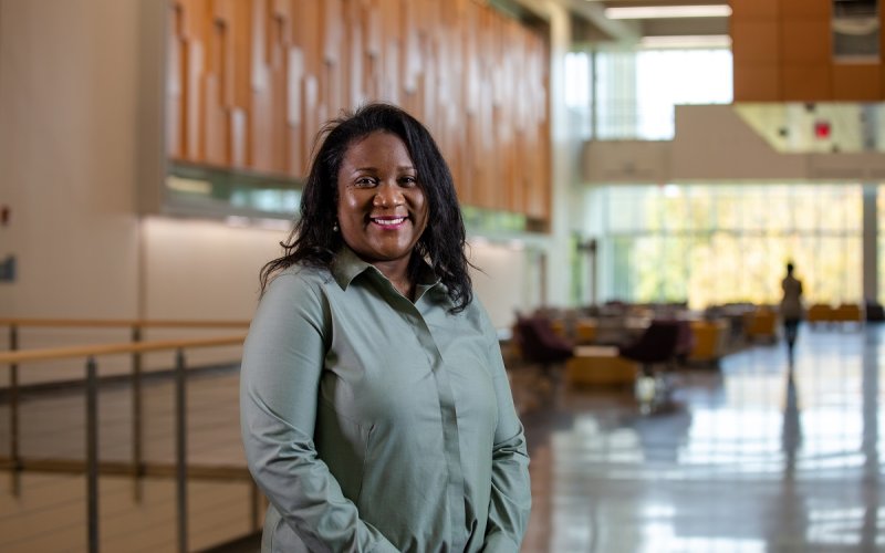 DeeDee Bennett Gayle, associate professor at the College of Emergency Preparedness, Homeland Security and Cybersecurity, stands inside the ETEC atrium.