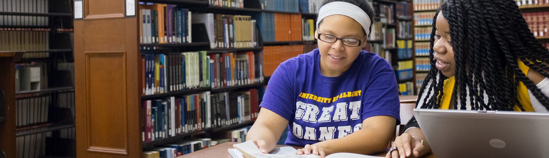 Two students studying in the UAlbany Dewey Library.