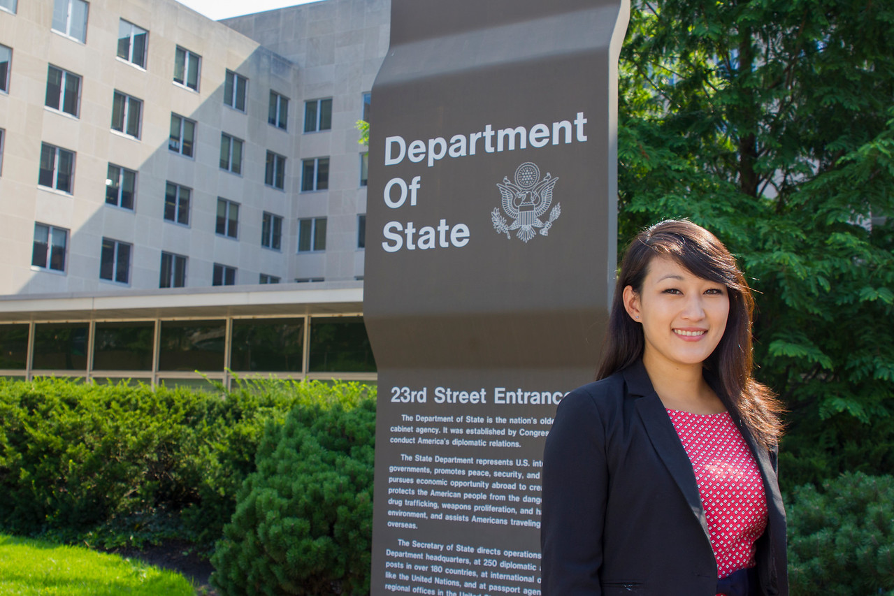 Alum Tina Chang in front of the U.S. Department of State in Washington, D.C. 