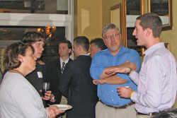 Justin Sayles and Syracuse-area alumni at gathering