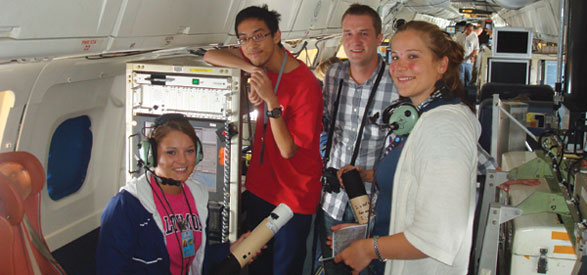 Nguyen, second from left, and Thomas, at right, are pictured aboard a research aircraft with fellow GRIP participants Janel Thomas of the University of Maryland and Andrew Martin of Florida State