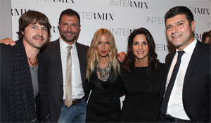 Adrienne Lazarus and celebrity stylist Rachel Zoe pose for a photo with, left to right, Zoe’s husband, Roger Berman, and Intermix co-founders Khajak Keledjian and Haro Keledjian