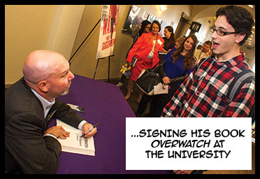 Marc Guggenheim signing his book Overwatch at the University