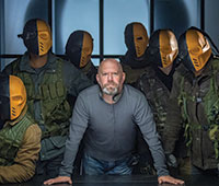 Marc Guggenheim poses with the Makku Army from "Arrow"