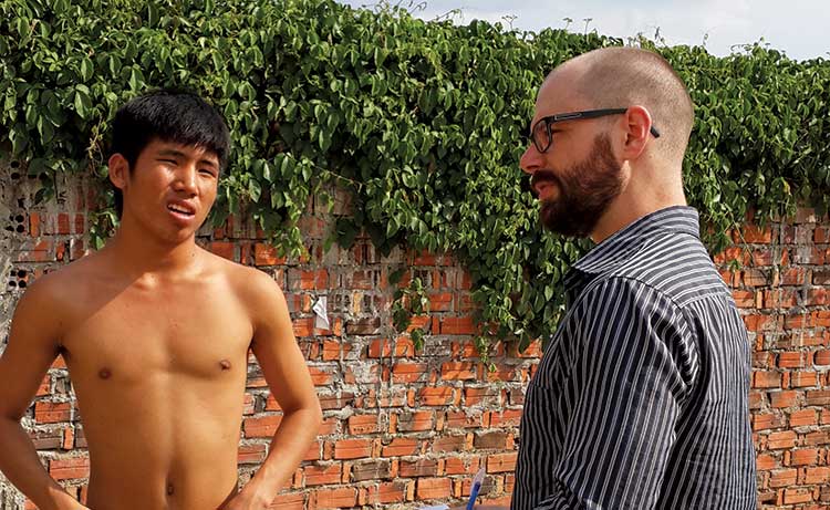 Chris Mueller interviews a Vietnamese refugee