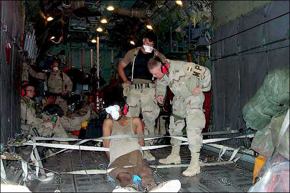 AP Photo Archive of an image of prisoners detained in Afghanistan being transported by US marines.