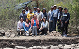 Verónica Pérez Rodríguez (center, orange), an associate professor of anthropology at the University at Albany, with UAlbany doctoral student Alba Tellez (bottom left) and the rest of the Cerro Jazmin Archaeological Project crew in Oaxaca, Mexico.