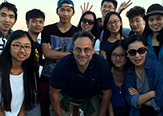 John G. Justino, director of the Center for Global Health and clinical associate professor in the School of Public Health, poses with students visiting from Sun-Yet Sen University (one of the School of Public Health's key international partners). The students pictured came on a Comparative Health System Exchange program trip organized by the Center for Global Health. 