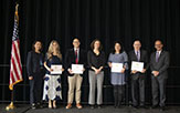 Some of the President’s Excellence Award for Teaching winners — Stephanie Affinito, Christopher Pastore, Samantha Friedman, Carmen Serrano and Mark Hughes — pose between Provost Carol Kim, left, and President Rodríguez. (Photos by Patrick Dodson)