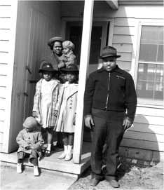 Black family moving into Sojourner Truth Homes, 1942.