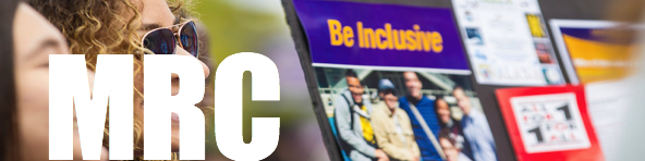 Link to MRC pages has MRC in Big white letters while a picture of two students tabling is faded out in the background for decor, a poster visible in the picture says Be inclusive in purple and gold.