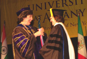 President Karen R. Hitchcock awarding Catherine Bertini the University Medallion