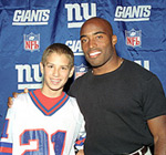 Tiki Barber with a fan