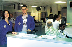 Vanessa Arcuri and Ryan Christensen at their frequent volunteer service post, the Albany Medical Center emergency room.