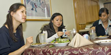 Sociologist Angie Chung shares a Patroon Room luncheon with undergraduates from her introductory lecture course.