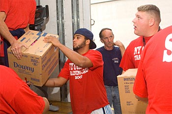 Colin Simmons helping the NY Giants move into their UAlbany summer home