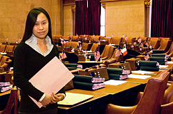 UAlbany student, Donna Yee working in the New York State Assembly chamber