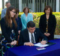 President George Philip '69, '73 Signs Environmental Pledge.