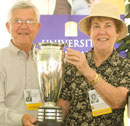 Ben Lindeman and Shelia Bamberger proudly accept the Attendance Cup on behalf of the Class of '57, which had the most members in attendance at Alumni Weekend.