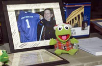 A display case shows memorabilia of Kermit Hall. The exhibit was viewed in the reception that immediately followed the Memorial Tribute.