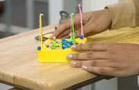 Staff members have brought in games to lighten the mood when customers do have to wait. The fishing game shown here has proven to be popular with students.