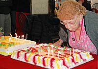 Tina Badi blows out the candles on her birthday cake.