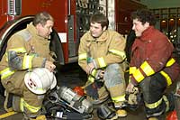 Volunteer Fire Department Chief David Clancy with UAlbany students Joseph Zambon and Michael Rothschild.