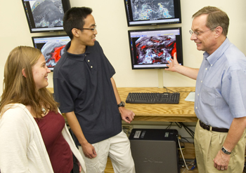 UAlbany grad students Diana Thomas and Leon Nguyen with Professor John Molinari.