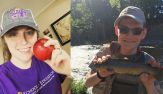 Olivia Pounds, holding an apple, and Kyle Lininger, holding a fish.