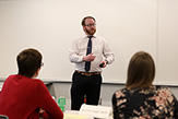 Photo of Benjamin Harris pitching his venture at the semi-finals competition in a classroom at the School of Business.