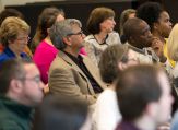 Faculty and staff listen to a presentation