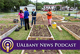 Four women stand around a community garden in Sullivan County, N.Y. 