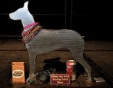 A metal Great Dane wearing beads, the prize for the Green Dane Award