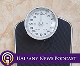 Image of a bathroom scale with UAlbany News Podcast logo.