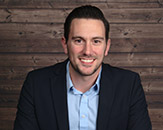 Headshot of Michael Riley, founder of Peak Neuro Group. 