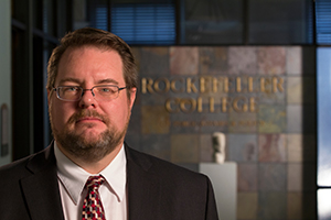 Karl Rethemeyer posing in Draper Hall