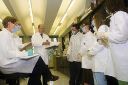 W. Mark Dale training students in the lab.