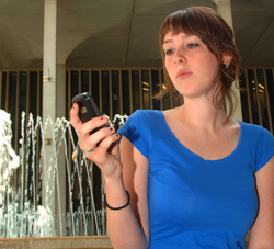UAlbany student receiving a text message.