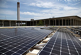 Photo of an array of 90 LG 350-watt solar panels atop the Campus Center West addition on the Uptown Campus.