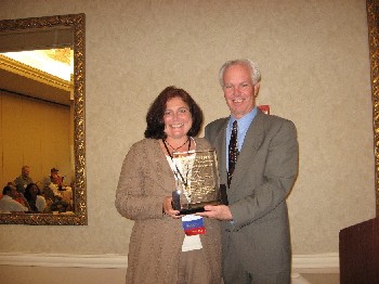 Lianne Fenn, assistant director of Institutional Services, receives the Industry's Leadership Award.