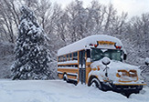 Photo of school bus in snowy conditions.
