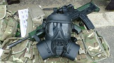 Photo of rifles and gas masks.