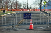 A campus road closed sign on display outside the Colonial Quad parking lot.