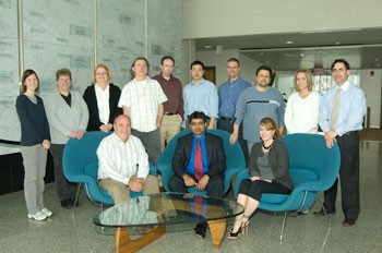 Research scientist Sridar Chittur collaborates with lab assistants and researchers at the Center for Functional Genomics.