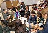 UAlbany President Robert Jones and students at Hackett Middle School