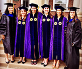 Last year's Department of Atmospheric and Environmental Sciences female PhD graduating class with professors Kristen Corbosiero (left) and Andrea Lang (right). 