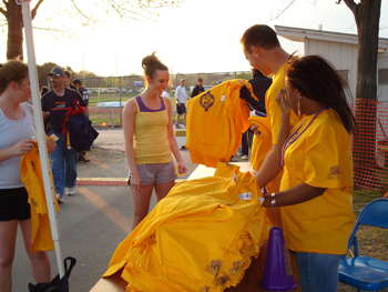Handing out T-shirts at the Spring Stomp.