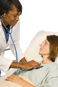 Doctor treating a patient in the hospital.