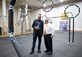 CEHC Professor of Practice Michael Leczinsky and Dean Bob Griffin stand inside the college's drone testing facility. 