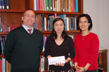 From left, Brian Keough (head of Special Collections), award winner Eugenia Kim, and sponsoring professor Dr. Donghee Sinn.